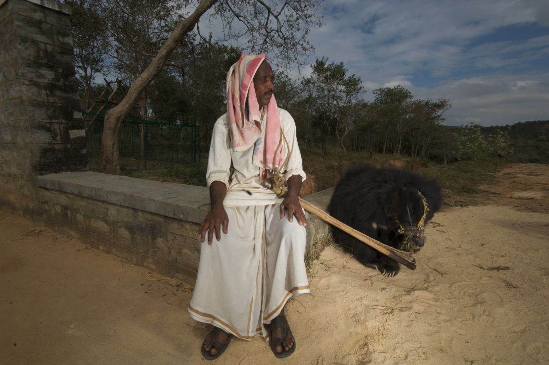 A kalandar man with his dancing bear